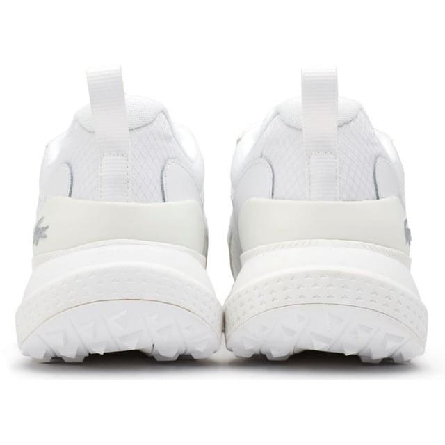 Lacoste L003 Neo Trainers The L003 Neo lifestyle trainer from Lacoste fuses statement aesthetics with sport-informed detailing. Featuring bold styling but with added technical details, including a mix of premium materials, a durable, wedged sole and ergonomic features. This modern sports shoe showcases the traditional Lacoste branding including the famous croc symbol on the side.