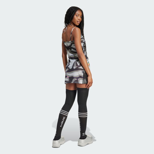 The adidas x Pabllo Vittar Pride collection features some of adidas' classic silhouettes, with each piece infused with Vittar's on-stage signature style. Drawing inspiration from Brazilian swimwear, the collection is designed to complement different body shapes so everyone can feel powerful in their own skin. With the rallying cry of "Love Unites," the collection celebrates individuality, our bodies as they are and encourages allyship.Go beyond bold in this adidas mesh dress. Under the sheer overlay, signature 3-Stripes set off a sea of rainbow colours, a nod to Brazilian pop star Pabllo Vittar's lyrics and confident style on the stage. When the spotlight hits the metallic logo, it reflects a message of love and unity. This product is made with at least 70% recycled materials. By reusing materials that have already been created, adidas help to reduce waste and our reliance on finite resources and reduce the footprint of the products adidas make.  -