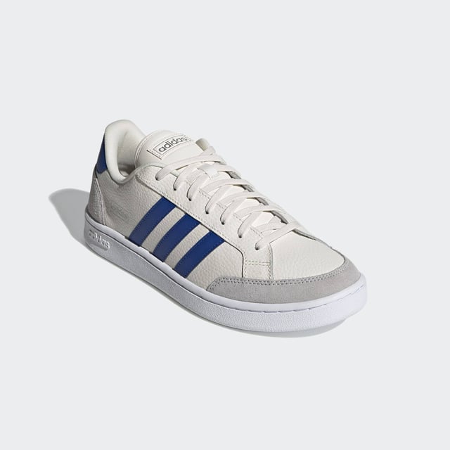 Vintage vibes. New soul. These shoes have a clean and contemporary design with the bones of '70s-era tennis trainers. This version has soft suede overlays and and a textured leather upper.  - Regular fit - Lace closure - Leather upper with suede toe and heel overlays - Cushioned feel - Tennis-inspired shoes - Cloudfoam Comfort sockliner and textile lining - Rubber cupsole  Shipped by adidas