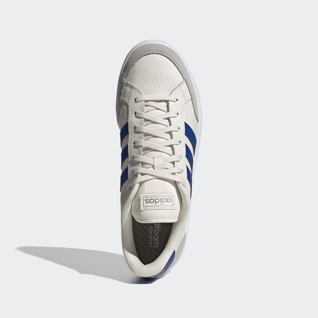 Vintage vibes. New soul. These shoes have a clean and contemporary design with the bones of '70s-era tennis trainers. This version has soft suede overlays and and a textured leather upper.  - Regular fit - Lace closure - Leather upper with suede toe and heel overlays - Cushioned feel - Tennis-inspired shoes - Cloudfoam Comfort sockliner and textile lining - Rubber cupsole  Shipped by adidas