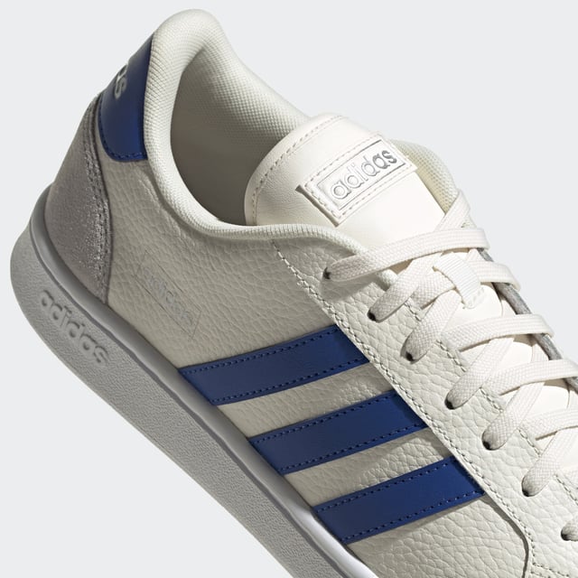 Vintage vibes. New soul. These shoes have a clean and contemporary design with the bones of '70s-era tennis trainers. This version has soft suede overlays and and a textured leather upper.  - Regular fit - Lace closure - Leather upper with suede toe and heel overlays - Cushioned feel - Tennis-inspired shoes - Cloudfoam Comfort sockliner and textile lining - Rubber cupsole  Shipped by adidas