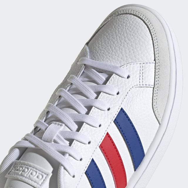 Vintage vibes. New soul. These shoes have a clean and contemporary design with the bones of '70s-era tennis trainers. This version has soft suede overlays and and a textured leather upper.  - Regular fit - Lace closure - Leather upper with suede toe and heel overlays - Cushioned feel - Tennis-inspired shoes - Cloudfoam Comfort sockliner and textile lining - Rubber cupsole  Shipped by adidas