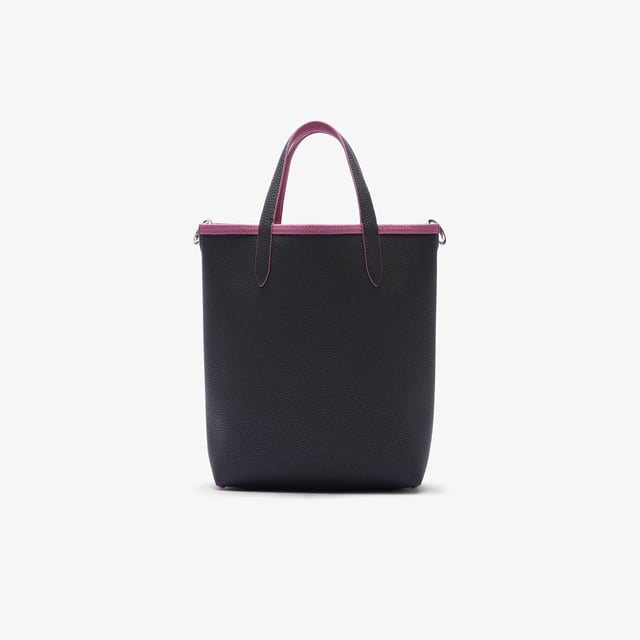 Anna Vertical Reversible Tote Dimensions: L8.7 x H11.4 x D 3.9in - L22 x H29 x D10cm  Removable  adjustable strap: 51in - 130cm Reversible bag with one grained and one piqué-effect embossed side Removable zipped pouch.Metal crocodile on one side