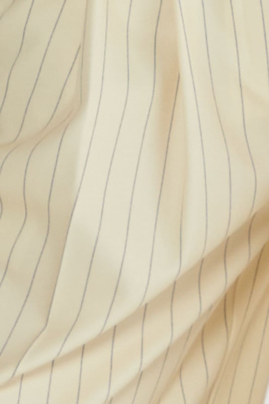 Tailored vest with elegant pinstripe pattern throughout
        Structured sweetheart neckline with button-front closure
        Halter-style straps for a sophisticated silhouette
        Cropped length perfect for contemporary workwear styling
        Fitted design with subtle back detailing for a polished finish
    
    This Nasty Gal tailored vest reimagines office attire with contemporary flair. The structured silhouette and classic pinstripe pattern create a professional look whilst the cropped length and sweetheart neckline add a modern twist. Style with the matching wide-leg trousers as shown for a coordinated ensemble that commands attention in the boardroom. For a more versatile approach, pair with high-waisted tailored trousers and a crisp white shirt underneath. Complete your workwear look with minimal jewellery and pointed court shoes for meetings, or dress down with loafers for casual Friday. This versatile piece transitions seamlessly from day to evening - simply add statement earrings and a clutch bag for after-work gatherings. The vest's structured design flatters the figure whilst maintaining workplace appropriateness.