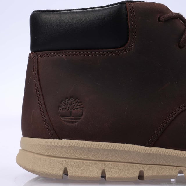 Mens Timberland Graydon Mid Lace Boots in dark brown.- Leather upper.- Lace-up style.- Cushioned collar and tongue.- Embossed logo on heel.- HoverLite comfort outsole and ReBOTL fabric lining.- Durable rubber outsole.- Ref: A5SEZV131