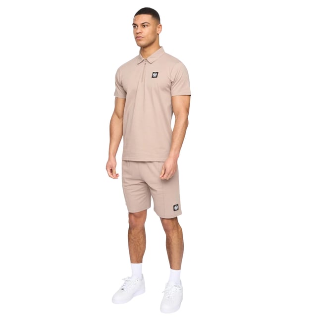 100% Cotton. Fabric: Jersey, Soft Touch. Design: Logo, Rubber Badge. Waistline: Elasticated. Sleeve-Type: Short-Sleeved. Neckline: Turn Down Collar. Fastening: Pull Over, Quarter Zip. Contents: 1 Polo Shirt, 1 Shorts. Fit: Relaxed Fit. S: 38 in. M: 40 in. L: 42 in. XL: 44 in. XXL, XXL, XXL: 46 in, 46 in.