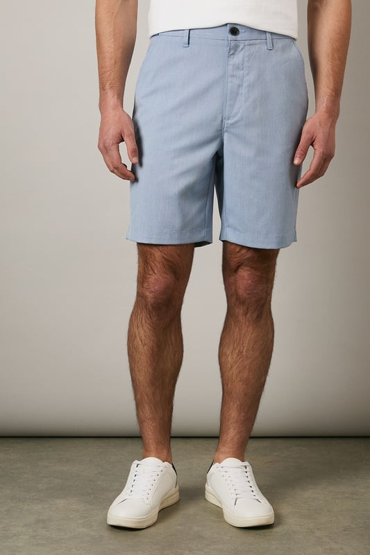 Textured woven fabric adds subtle dimension and visual interest
        Classic chino design with clean-cut finish for versatile styling
        Mid-thigh length offering comfortable coverage
        Flat front design creates a sleek, contemporary silhouette
        Rear pocket detailing for practical everyday wear
    
    These Maine textured chino shorts combine comfort with casual sophistication. The clean lines and tailored fit make them an essential addition to your warm-weather wardrobe. Style them as shown with a crisp white t-shirt and trainers for effortless weekend outings, or pair with a linen shirt and loafers for garden parties and family gatherings. The versatile design transitions seamlessly from daytime casual to evening relaxed events. Perfect for holidays abroad or British summer days, these shorts offer both comfort and style without compromising on quality. The textured fabric adds a refined touch that distinguishes them from ordinary shorts, making them ideal for those who appreciate subtle details in their casual attire.