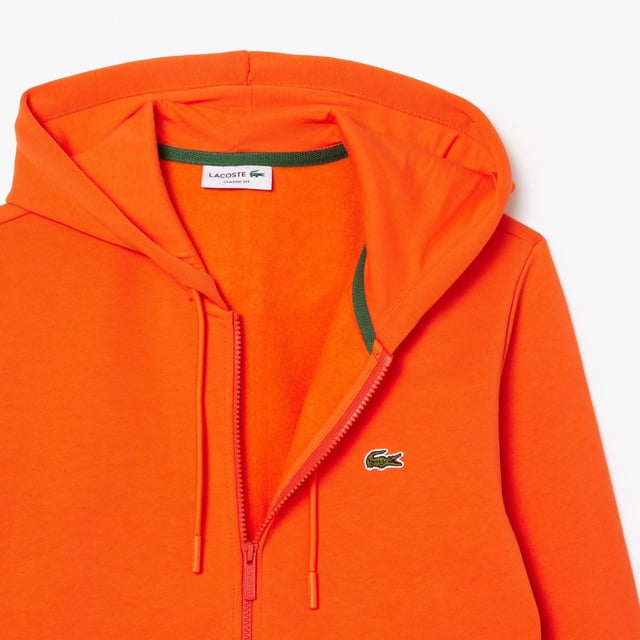 Zip-Up Fleece Hoodie Organic brushed cotton and recycled polyester Classic fit for natural ease Kangaroo pocket Jersey-lined hood Embroidered crocodile on chest