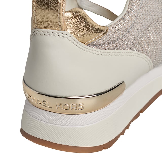 The Allie Stride leather sneakers are perfect for adding an irresistible touch of luxury to any look. This low-top style features shiny chainmail mesh panels and the brand's initials to add a little sparkle to every step. They're perfect for transitioning from the gym to the city.\n\n Details:\n - Almond tip.\n - Lace-up closure.\n - Shiny leather/chain mesh.\n - Padded textile insole.\n - Metallic Michael Kors logo on the back and instep.\n\n A good pair of women's designer sneakers will take you anywhere. Whether you're going for a stroll, exploring the city, or taking a long trip, casual women's sneakers allow you to arrive at your destination in style. If you're looking for a revamped take on a classic, high-top designer sneakers are the best option. Sneakers with a retro-inspired silhouette look great with both cropped jeans and minidresses. For traveling, slip-on sneakers are the best option. They're ideal for slipping on and off during security, as well as for great comfort while exploring a new city.\n Composition: 100% Leather, Textile\n Care:\nUse a soft, damp cloth to clean the surface.