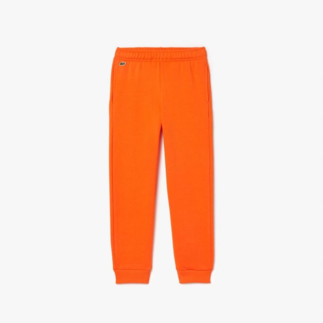 Fleece Sweatbroek Organisch geborsteld katoenen fleece en gerecycled polyester Verborgen zijzakken Elastische taille met trekkoord Elastische enkels voor betere pasvorm Geborduurde krokodil