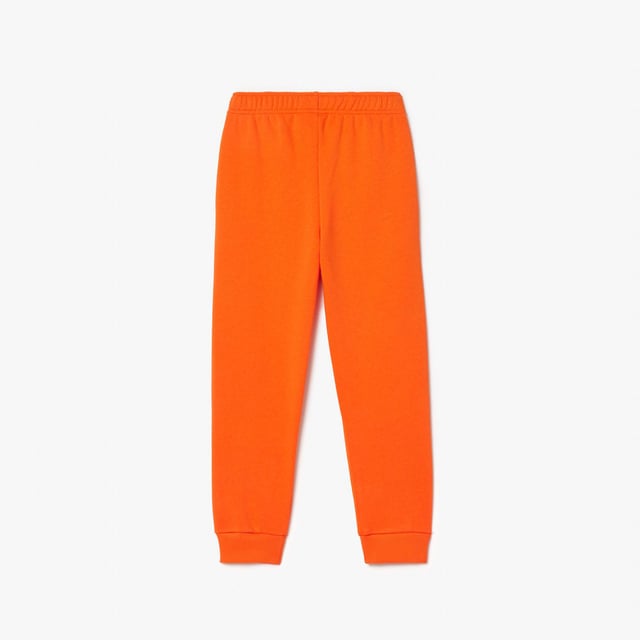 Fleece Sweatbroek Organisch geborsteld katoenen fleece en gerecycled polyester Verborgen zijzakken Elastische taille met trekkoord Elastische enkels voor betere pasvorm Geborduurde krokodil