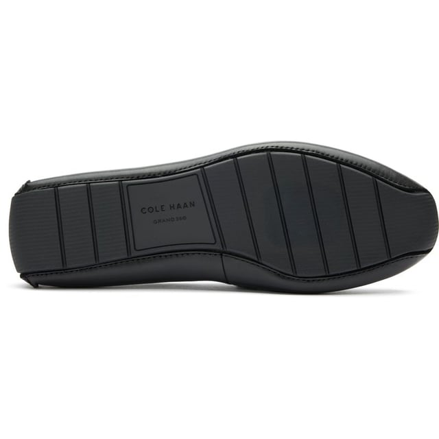 Mens black Cole Haan driving shoes, manufactured with leather and a rubber sole. Featuring: elastic side gusset, cole haan branding, soft leather, padded insole and driving sole.