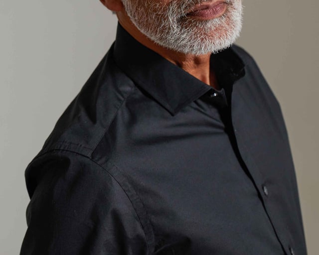 We've added a hint of stretch to this men's slim fit cotton shirt to allow better ease of movement and all-day comfort - whether you're at a wedding or an important business event. You'll find our usual curl-resistant collar, plus single cuffs and back darts.