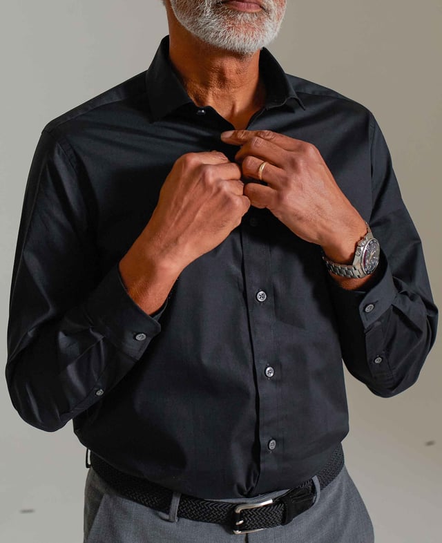 We've added a hint of stretch to this men's slim fit cotton shirt to allow better ease of movement and all-day comfort - whether you're at a wedding or an important business event. You'll find our usual curl-resistant collar, plus single cuffs and back darts.