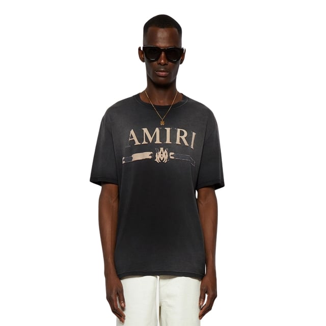 Upgrade your style and stand out with the AMIRI MA Bar Applique Black T-Shirt! Crafted from premium 100% cotton, this iconic tee boasts the brand's distinctive bar applique, bringing edgy flair to your outfits. You'll love the bold statement this shirt makes, and you'll never want to part with it!