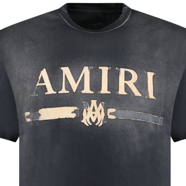 Upgrade your style and stand out with the AMIRI MA Bar Applique Black T-Shirt! Crafted from premium 100% cotton, this iconic tee boasts the brand's distinctive bar applique, bringing edgy flair to your outfits. You'll love the bold statement this shirt makes, and you'll never want to part with it!