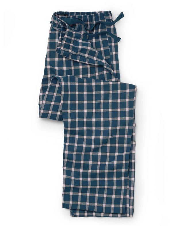 Relax in style with these men's navy and pink check lounge pants. Made from 100% pure brushed cotton, they offer an exceptionally soft and warm feel, perfect for cosy evenings or working from home. The fully elasticated waist is enhanced with classic herringbone detailing, providing both comfort and a touch of sophistication. Designed with convenience in mind, these lounge pants feature a single back pocket adorned with an embroidered logo. 100% pure brushed cotton, warm, soft and cosy. Fully elasticated waist with contrast herringbone. One pocket at the back with embroidered logo. Machine washable at 40°C. Presented in fully recyclable packaging.