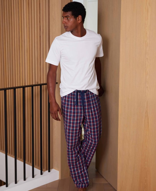 Experience the ultimate in comfort with our red, navy and white check lounge pants. Made from 100% cotton that’s been brushed for cosiness, they are luxuriously soft, wrapping you in luxury warmth perfect for lazy days at home or working from home. 100% pure brushed cotton, warm, soft and cosy. Fully elasticated waist with contrast herringbone. One pocket at the back with embroidered logo. Inside leg on a size Medium is 31" / 79cm. Presented in fully recyclable packaging.