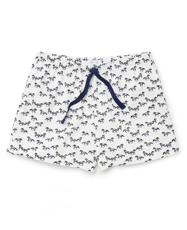 A must-have for animal lovers, this women's pyjama set includes a soft slub jersey vest and horse-print shorts made from organic cotton. A comfortable choice for bed, it's also great for lounging at home. Vest and lounge shorts set. Lily Of The Row branding. Vest 100% slubbed cotton single jersey 160gr; shorts 100% pure organic cotton printed poplin. Vest; small chest pocket. Scooped hem. Semi fitted. Centre back length on size 12 is 60cm. Shorts; navy herringbone tape drawstring at waist. Easy pull on shorts with side pockets. Relaxed fit. Inside leg on size 12 is 9.5cm. Machine wash at 40°C. Presented in fully recyclable packaging. Safety warning: keep away from fire.