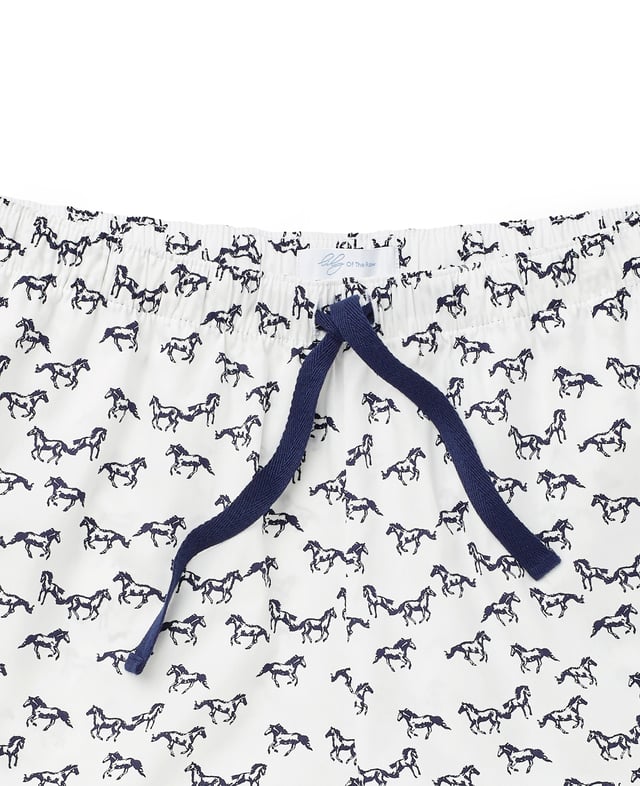 A must-have for animal lovers, this women's pyjama set includes a soft slub jersey vest and horse-print shorts made from organic cotton. A comfortable choice for bed, it's also great for lounging at home. Vest and lounge shorts set. Lily Of The Row branding. Vest 100% slubbed cotton single jersey 160gr; shorts 100% pure organic cotton printed poplin. Vest; small chest pocket. Scooped hem. Semi fitted. Centre back length on size 12 is 60cm. Shorts; navy herringbone tape drawstring at waist. Easy pull on shorts with side pockets. Relaxed fit. Inside leg on size 12 is 9.5cm. Machine wash at 40°C. Presented in fully recyclable packaging. Safety warning: keep away from fire.