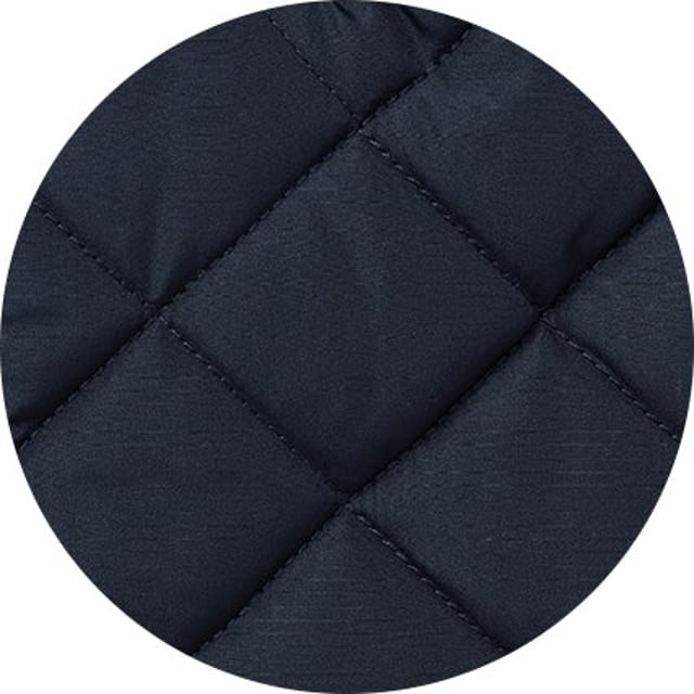 This quilted jacket was the go-to choice for discerning gentlemen last winter - and it's back again to elevate your winter style. Crafted for warmth without restriction, it features refined cotton corduroy trim and multiple pockets to keep your daily essentials at hand. Whether you're navigating city streets or venturing into the countryside, this jacket blends functionality with timeless appeal. Made from 100% polyester quilted outer with a 100% polyester navy lining. Centre back length on size Medium is 72 cm. Edges trimmed in 100% cotton corduroy. Medium weight wadding for extra warmth. Regular fit. Two patch pockets and zipped pocket; back has a poppered flap; matte navy matching studs.