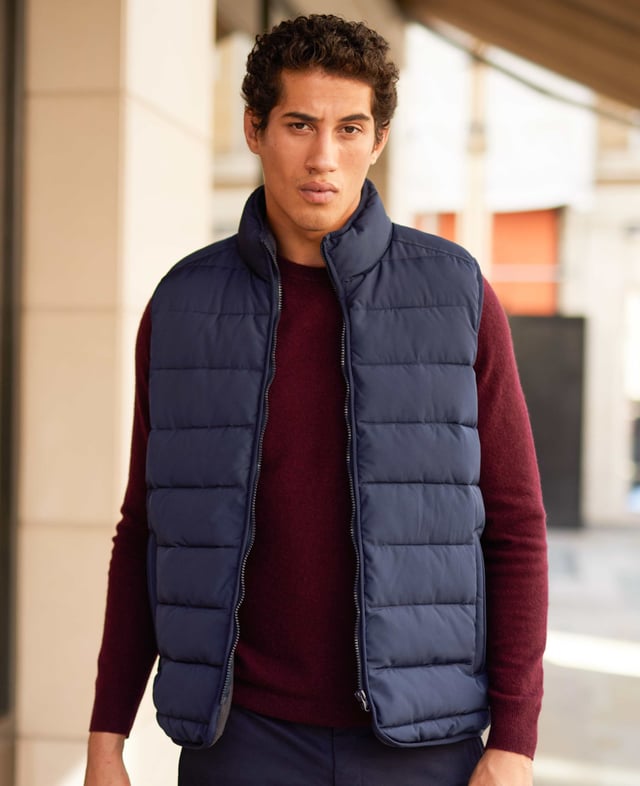 A sustainable choice, this quilted gilet is made using recycled fabrics, including the padding. There's multiple pockets to keep your essentials safe, while the back is cut a little longer than the front to avoid gaping. Tunnel quilted showerproof 100% ocean recycled polyester outer.  Eco friendly down-like 230g wadding for good insulation without the weight.  Lined in 100% grey polyester microfleece.  Outside 2 zipped welt pockets, inside one chest pocket.  Back is a little longer than front.  Funnel neck with front zip.  Centre back length on a size Medium is 72.5cm.  Can be dry cleaned.  Presented in fully recyclable packaging.
