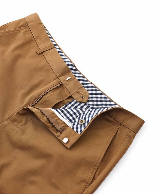 An essential staple for the warmer months, our stretch cotton chinos are comfortable and breathable - helping you keep cool on long commutes and summer holidays. Cut to a tailored fit shape, they pair perfectly with a short-sleeved shirt and penny loafers. 96% cotton, 4% elastane. Medium weight durable cotton twill with a slight amount of stretch for comfort and retaining shape. Flat front, slim through the thigh. Length finishes just above the knee. Slanted pockets; jetted buttoned back pockets. Machine washable at 40°C. Safety warning: keep away from fire.