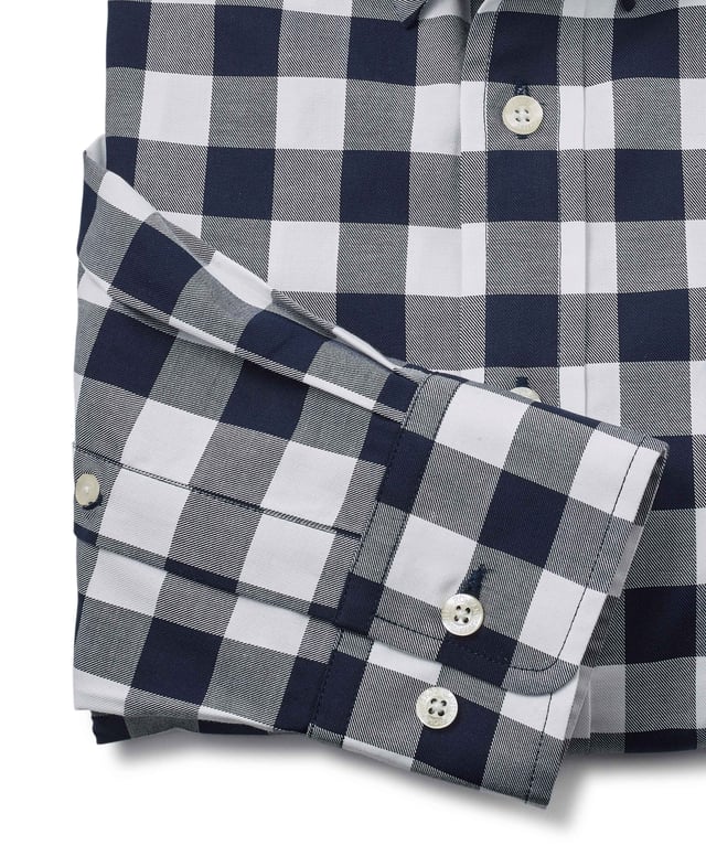 This men's casual shirt features a bold navy and white check design. It's made from 100% BCI cotton in a luxurious fine twill weave and features a classic button-down collar. The classic fit shape offers plenty of room for movement.