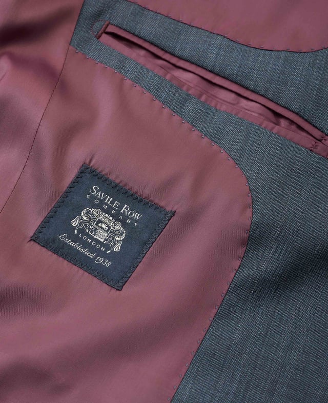 Made from a wool-blend fabric and tailored for a flattering fit, our men's herringbone suit jacket features a two-button fastening and double back vents for ease of movement. Inside you'll find luxury gold lining, while there's multiple pockets to keep your essentials safe. Outer; 44% virgin wool, 53% polyester, 3% elastane 265 grms/m ² lining; 100% polyester. Wool is harvested in a non mulesed manner which is in line with cruelty free policies. Tailored fit. Jacket is single breasted with 2 button front; 2 back vents. Jacket has columbian stitching on inside facing. Gold coloured lining.
