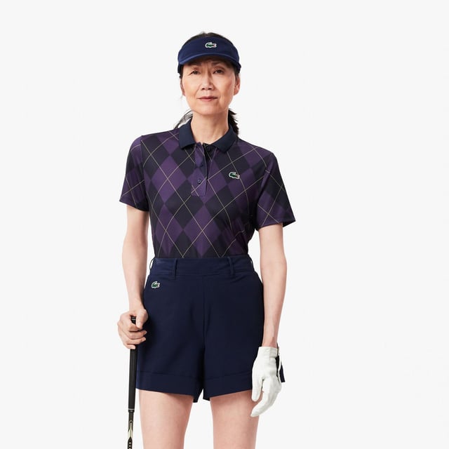 Womens Lacoste SPORT Regular Fit UV Protect Golf Polo Shirt in navy blue - purpleThis Lacoste polo shirt is designed for expert golfers  featuring Ultra Dry technology and UPF50+ protection. With a print inspired by the Lacoste archives for added croco-style. We'll handle the look; you handle the swing.- Recycled polyester made from manufacturing offcuts- Regular fit  straight cut- Polo collar- Tested by golf professionals- UPF 50 UV protection- Silicone crocodile on chest- Main fabric: Polyester (94%)  Elastane (6%) - Collar: Polyester (98%)  Elastane (2%).  Machine washable.- Ref: PF7453-IEK