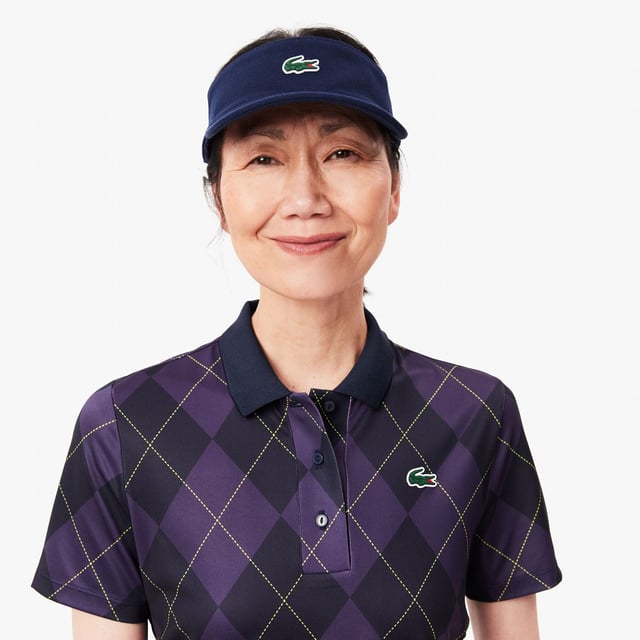 Womens Lacoste SPORT Regular Fit UV Protect Golf Polo Shirt in navy blue - purpleThis Lacoste polo shirt is designed for expert golfers  featuring Ultra Dry technology and UPF50+ protection. With a print inspired by the Lacoste archives for added croco-style. We'll handle the look; you handle the swing.- Recycled polyester made from manufacturing offcuts- Regular fit  straight cut- Polo collar- Tested by golf professionals- UPF 50 UV protection- Silicone crocodile on chest- Main fabric: Polyester (94%)  Elastane (6%) - Collar: Polyester (98%)  Elastane (2%).  Machine washable.- Ref: PF7453-IEK