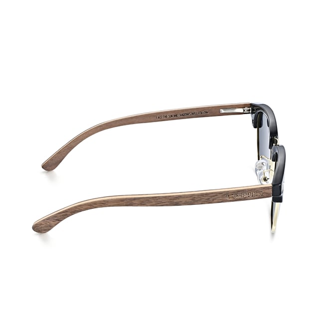Earth Wood Marokopa Polarized Sunglasses - Walnut/Grey Frame: Black Gold Polycarbonate ; Arm: Black Walnut Wood; Earpiece: Black Walnut Wood; Lens: Grey Multi-Layer Triacetate Cellulose (TAC); Mirrored Lens: No; Gradient Lens: No; Polarization: Optical Quality; UV Protection: 100% UVA/UVB; Hinge: Spring Loaded Stainless Steel; Adjustable Nosepads: Yes; Lens Width: 47mm; Temple Length: 141mm; Bridge Width: 23mm.