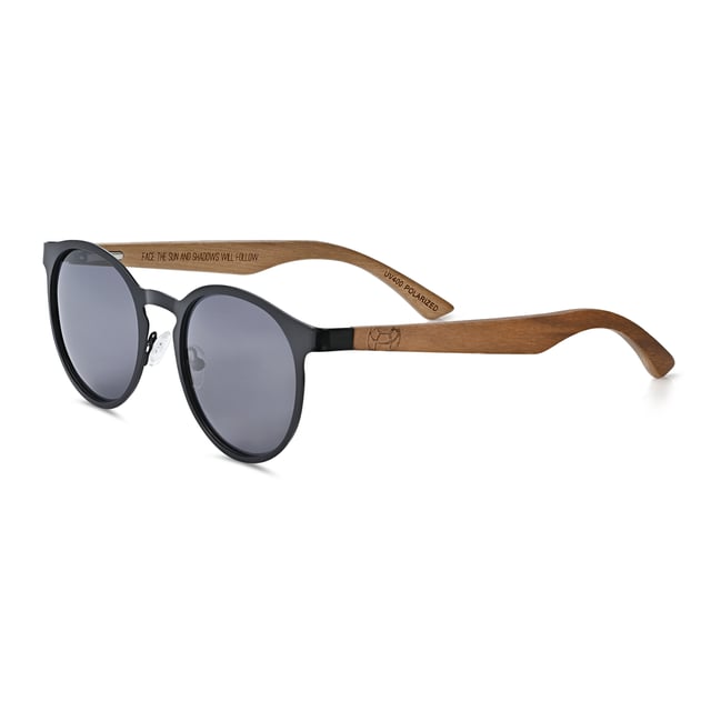 Earth Wood Reine Polarized Sunglasses - Dark Brown/Black Frame: Black Metal ; Arm: Dark Brown Wood; Earpiece: Dark Brown Wood; Lens: Black Multi-Layer Triacetate Cellulose (TAC); Mirrored Lens: No; Gradient Lens: No; Polarization: Optical Quality; UV Protection: 100% UVA/UVB; Hinge: Spring Loaded Stainless Steel; Adjustable Nosepads: Yes; Lens Width: 60mm; Temple Length: 148mm; Bridge Width: 20mm.