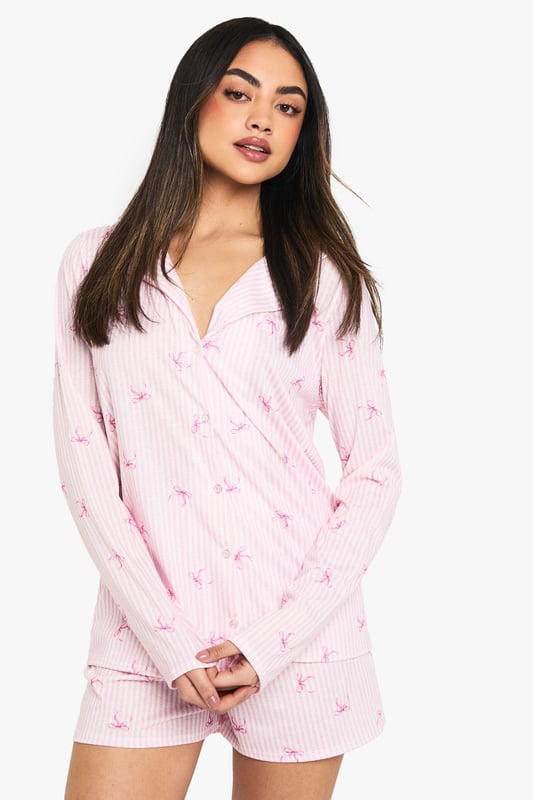 Charming striped pattern with delicate motif print
        Long-sleeved shirt with notched collar for a classic look
        Comfortable knitted fabric for cosy nights
        Matching shorts with relaxed fit
        Versatile two-piece set for mix-and-match styling
    
    Drift off to dreamland in style with this enchanting pyjama set from Boohoo. The long-sleeved shirt boasts a charming striped pattern adorned with a delicate motif print, adding a touch of whimsy to your nighttime routine. Crafted from soft knitted fabric, this set promises ultimate comfort for those lazy mornings and cosy nights in. The relaxed fit shorts complete the ensemble, offering versatility for warmer evenings. Perfect for lounging, this set can be easily mixed and matched with other nightwear pieces in your collection. Whether you're having a girls' night in or treating yourself to a pamper session, this pyjama set will keep you feeling fabulous and relaxed. Pair with fluffy slippers and a warm dressing gown for the ultimate night-in ensemble.