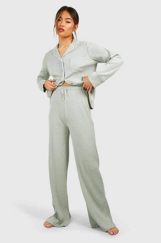 Ribbed jersey fabric for comfort and texture
        Tie waist detail for adjustable fit
        Wide-leg silhouette for relaxed style
        High-waisted design for flattering shape
        Coordinating top available for a complete set
    
    Embrace laid-back luxury with these rib tie waist lounge trousers from Boohoo. Perfect for those cosy nights in or lazy weekend mornings, these trousers offer both style and comfort. The ribbed jersey fabric feels soft against the skin, while the wide-leg silhouette allows for unrestricted movement. The high-waisted design with a tie waist detail not only adds a trendy touch but also ensures a customisable fit. Pair with the matching top for a coordinated loungewear look, or mix and match with your favourite tees and sweatshirts. Whether you're settling in for a movie marathon or hosting a casual brunch at home, these versatile trousers will keep you feeling relaxed and looking effortlessly chic. Add some fuzzy socks and a warm cuppa for the ultimate lounging experience.