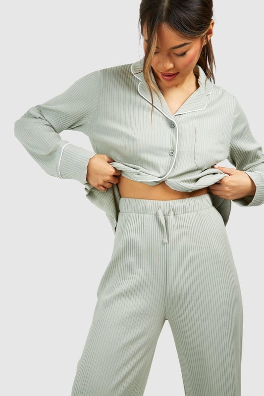 Ribbed jersey fabric for comfort and texture
        Tie waist detail for adjustable fit
        Wide-leg silhouette for relaxed style
        High-waisted design for flattering shape
        Coordinating top available for a complete set
    
    Embrace laid-back luxury with these rib tie waist lounge trousers from Boohoo. Perfect for those cosy nights in or lazy weekend mornings, these trousers offer both style and comfort. The ribbed jersey fabric feels soft against the skin, while the wide-leg silhouette allows for unrestricted movement. The high-waisted design with a tie waist detail not only adds a trendy touch but also ensures a customisable fit. Pair with the matching top for a coordinated loungewear look, or mix and match with your favourite tees and sweatshirts. Whether you're settling in for a movie marathon or hosting a casual brunch at home, these versatile trousers will keep you feeling relaxed and looking effortlessly chic. Add some fuzzy socks and a warm cuppa for the ultimate lounging experience.