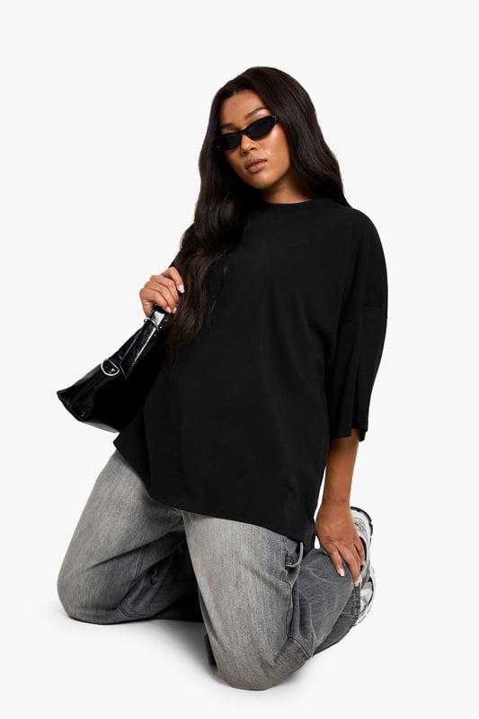 Super oversized fit for maximum comfort and contemporary style
        Crafted from soft cotton fabric for all-day wearability
        Relaxed dropped shoulders and roomy elbow-length sleeves
        Clean, minimalist design with a subtle crew neckline
        Generous length providing versatile styling options
    
    Make a bold statement with this super oversized cotton T-shirt from Boohoo. The relaxed silhouette creates an effortlessly cool vibe that works brilliantly with slim-fit bottoms for a balanced look. As seen on our model, pair with light grey joggers or leggings for casual daytime outings. The generous proportions allow for various styling options-try a half-tuck at the front with high-waisted jeans, or layer over cycling shorts for an on-trend ensemble. Perfect for casual coffee dates, weekend shopping trips, or lounging at home in style. The versatile design transitions seamlessly from day to night-simply add statement jewellery and trainers for an elevated casual look. This T-shirt embodies the laid-back yet fashion-forward aesthetic that's essential for your everyday wardrobe.