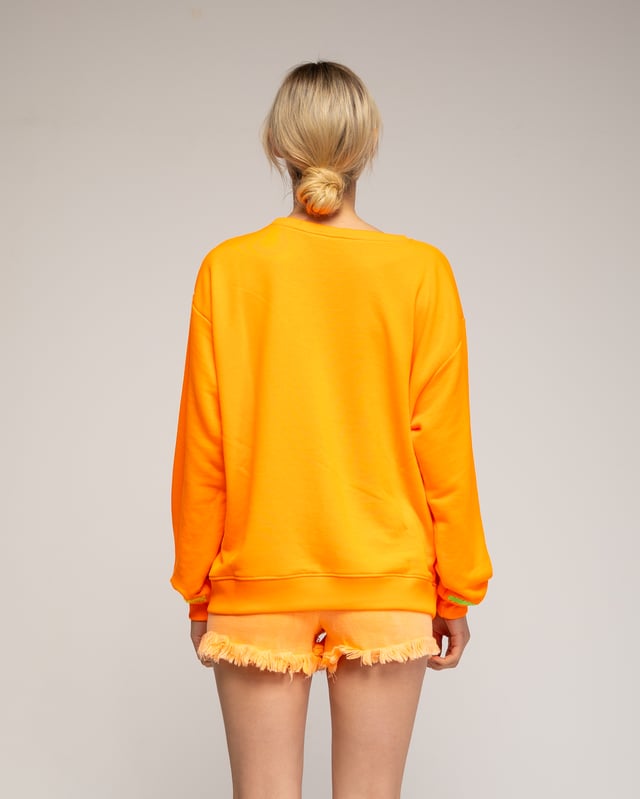Fluor sweatshirt med "smile"-mönster och broderi på framsida och ärmslut