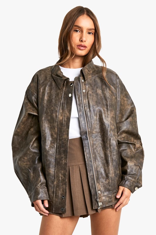 Vintage-inspired faux leather biker jacket
        Oversized fit for a relaxed, effortless look
        Distressed finish adds character and edge
        Zip-up front closure for easy wear
        Ribbed hem and cuffs for a snug fit
    
    Channel your inner rebel with this vintage-inspired faux leather biker jacket. The oversized silhouette offers a contemporary twist on a classic style, perfect for those who want to make a statement. The distressed finish gives the jacket a lived-in look, adding depth and character to your ensemble. Pair it with a crisp white tee and pleated mini skirt for a chic contrast, or throw it over a flowy maxi dress to add some edge to a feminine look. For casual outings, team it with your favourite jeans and ankle boots. This versatile piece is ideal for family gatherings, brunches with friends, or a night out at your local pub. The faux leather material ensures easy care, making it a practical choice for the fashion-forward woman who values both style and convenience.