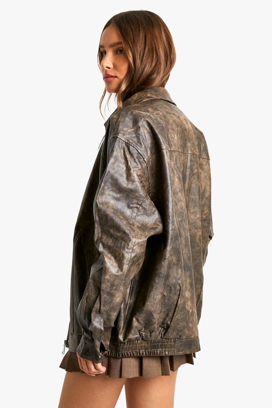 Vintage-inspired faux leather biker jacket
        Oversized fit for a relaxed, effortless look
        Distressed finish adds character and edge
        Zip-up front closure for easy wear
        Ribbed hem and cuffs for a snug fit
    
    Channel your inner rebel with this vintage-inspired faux leather biker jacket. The oversized silhouette offers a contemporary twist on a classic style, perfect for those who want to make a statement. The distressed finish gives the jacket a lived-in look, adding depth and character to your ensemble. Pair it with a crisp white tee and pleated mini skirt for a chic contrast, or throw it over a flowy maxi dress to add some edge to a feminine look. For casual outings, team it with your favourite jeans and ankle boots. This versatile piece is ideal for family gatherings, brunches with friends, or a night out at your local pub. The faux leather material ensures easy care, making it a practical choice for the fashion-forward woman who values both style and convenience.