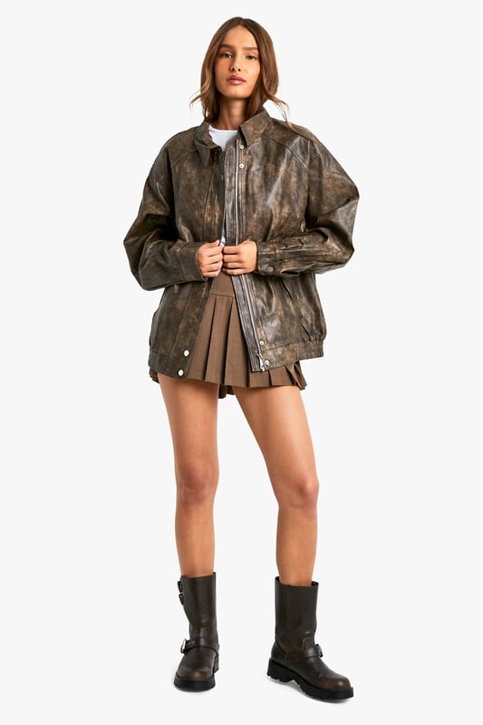 Vintage-inspired faux leather biker jacket
        Oversized fit for a relaxed, effortless look
        Distressed finish adds character and edge
        Zip-up front closure for easy wear
        Ribbed hem and cuffs for a snug fit
    
    Channel your inner rebel with this vintage-inspired faux leather biker jacket. The oversized silhouette offers a contemporary twist on a classic style, perfect for those who want to make a statement. The distressed finish gives the jacket a lived-in look, adding depth and character to your ensemble. Pair it with a crisp white tee and pleated mini skirt for a chic contrast, or throw it over a flowy maxi dress to add some edge to a feminine look. For casual outings, team it with your favourite jeans and ankle boots. This versatile piece is ideal for family gatherings, brunches with friends, or a night out at your local pub. The faux leather material ensures easy care, making it a practical choice for the fashion-forward woman who values both style and convenience.