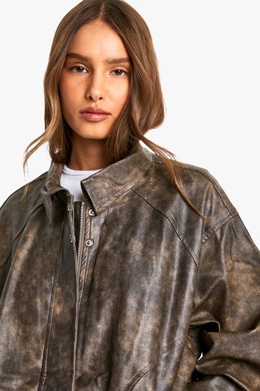 Vintage-inspired faux leather biker jacket
        Oversized fit for a relaxed, effortless look
        Distressed finish adds character and edge
        Zip-up front closure for easy wear
        Ribbed hem and cuffs for a snug fit
    
    Channel your inner rebel with this vintage-inspired faux leather biker jacket. The oversized silhouette offers a contemporary twist on a classic style, perfect for those who want to make a statement. The distressed finish gives the jacket a lived-in look, adding depth and character to your ensemble. Pair it with a crisp white tee and pleated mini skirt for a chic contrast, or throw it over a flowy maxi dress to add some edge to a feminine look. For casual outings, team it with your favourite jeans and ankle boots. This versatile piece is ideal for family gatherings, brunches with friends, or a night out at your local pub. The faux leather material ensures easy care, making it a practical choice for the fashion-forward woman who values both style and convenience.