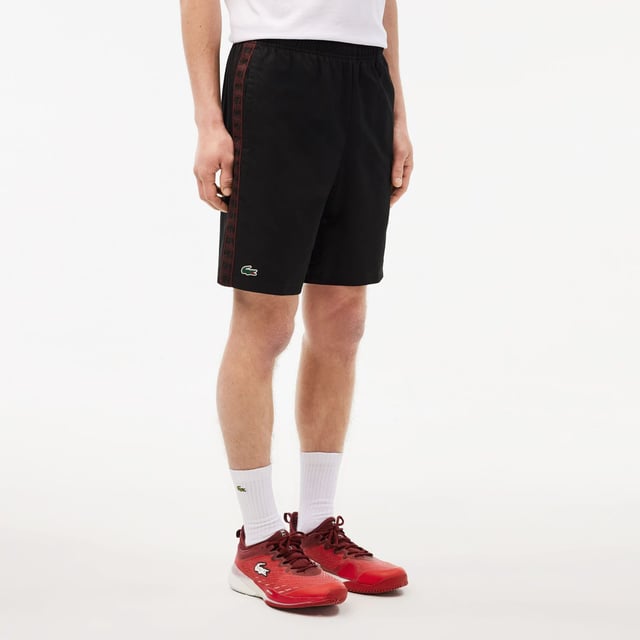 Diamond Taffeta Tennis Shorts Recycled polyester diamond taffeta  limiting the production of virgin materials Regular  straight cut Adjustable drawstring waist Short cut: crotch height 21 cm Silicone crocodile on side