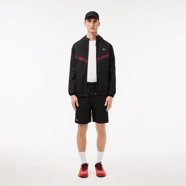 Diamond Taffeta Tennis Shorts Recycled polyester diamond taffeta  limiting the production of virgin materials Regular  straight cut Adjustable drawstring waist Short cut: crotch height 21 cm Silicone crocodile on side