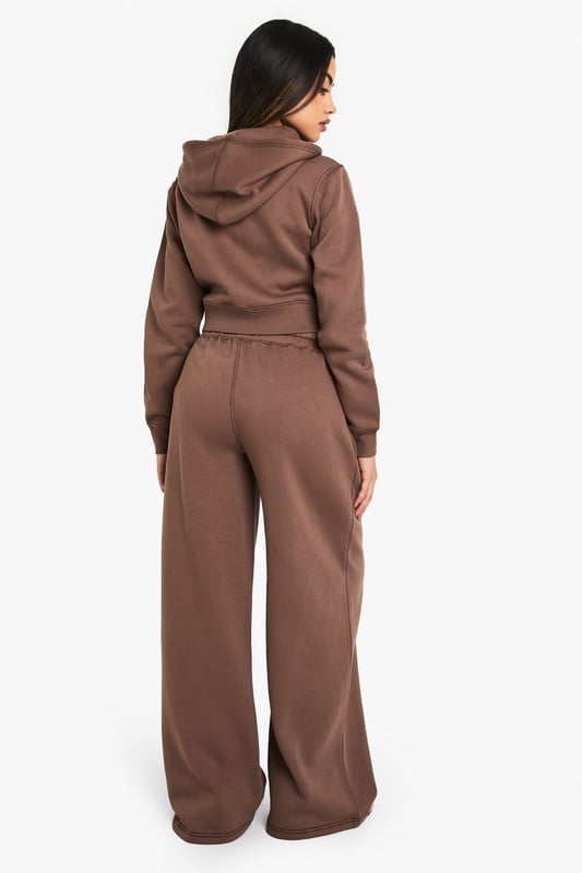 Straight-leg design for a modern silhouette
        Contrast stitching adds a subtle decorative touch
        Comfortable elasticated waistband with drawstring
        Side pockets for practicality
        Versatile joggers suitable for various casual occasions
    
    Embrace comfort without compromising on style with these straight-leg joggers from Boohoo. The contrast stitching adds a fashionable edge to this casual staple, making it perfect for the trend-conscious woman in her early to mid-20s. Pair with a cropped top and trainers for a laid-back look that's ideal for running errands or meeting friends for coffee. For a more put-together ensemble, try styling with a fitted zip-up hoodie and white trainers. These joggers are a versatile addition to your wardrobe, suitable for family gatherings, casual outings, or simply lounging at home. The straight-leg cut offers a flattering shape that's on-trend yet timeless, ensuring these joggers will be a go-to piece for seasons to come.