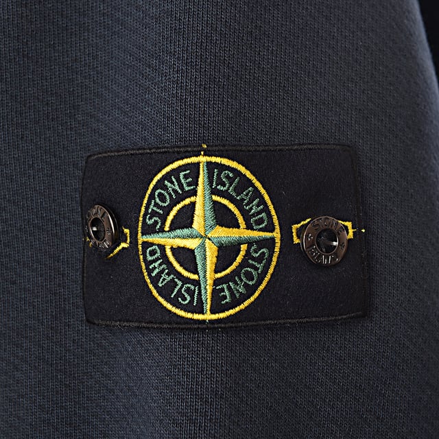 Authenticity Guaranteed - All Stone Island products feature a unique QR code for instant verification of authenticity. 
Stone Island Sweatshirts
       â€¢ Brand: Stone Island
       â€¢ Material: 100%Cotton
       â€¢ Design: Constructed from 100% cotton, this Stone Island sweatshirt ensures a soft, breathable fit perfect for everyday wear. The timeless crewneck style is complemented by ribbed cuffs and a ribbed hem, adding structure and comfort. The iconic Stone Island compass badge on the left sleeve is a subtle yet recognizable detail, reinforcing the brandâ€™s legacy of premium streetwear
       â€¢ Colour: Blue
       â€¢ Style: The Blue colour gives this sweatshirt a dynamic yet easygoing aesthetic, making it perfect for layering or wearing solo. Whether paired with denim for a relaxed street look or chinos for a more elevated vibe, it brings a vibrant yet balanced energy to your outfit