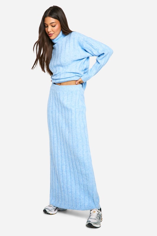 Ribbed texture for added visual interest and warmth
        Cosy roll neck design for ultimate comfort
        Coordinating crop top and maxi skirt set
        Versatile two-piece ensemble for mix-and-match styling
        Relaxed fit for effortless movement and layering
    
    Embrace laid-back luxury with this ribbed roll neck and maxi skirt co-ord set. The textured fabric adds depth to your look while ensuring you stay snug during cooler days. Perfect for casual outings or relaxed gatherings, this ensemble offers endless styling possibilities. Pair the crop top with high-waisted jeans for a trendy daytime look, or wear the set together for a chic, coordinated appearance. For a casual yet put-together outfit, team with chunky trainers and a crossbody bag. When the temperature drops, layer with an oversized denim jacket or a longline cardigan for added warmth. This versatile co-ord set is ideal for creating effortless, fashion-forward looks that transition seamlessly from day to night.