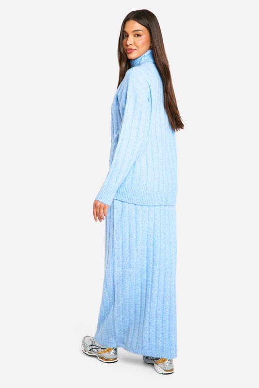 Ribbed texture for added visual interest and warmth
        Cosy roll neck design for ultimate comfort
        Coordinating crop top and maxi skirt set
        Versatile two-piece ensemble for mix-and-match styling
        Relaxed fit for effortless movement and layering
    
    Embrace laid-back luxury with this ribbed roll neck and maxi skirt co-ord set. The textured fabric adds depth to your look while ensuring you stay snug during cooler days. Perfect for casual outings or relaxed gatherings, this ensemble offers endless styling possibilities. Pair the crop top with high-waisted jeans for a trendy daytime look, or wear the set together for a chic, coordinated appearance. For a casual yet put-together outfit, team with chunky trainers and a crossbody bag. When the temperature drops, layer with an oversized denim jacket or a longline cardigan for added warmth. This versatile co-ord set is ideal for creating effortless, fashion-forward looks that transition seamlessly from day to night.