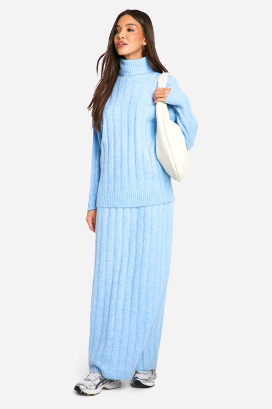 Ribbed texture for added visual interest and warmth
        Cosy roll neck design for ultimate comfort
        Coordinating crop top and maxi skirt set
        Versatile two-piece ensemble for mix-and-match styling
        Relaxed fit for effortless movement and layering
    
    Embrace laid-back luxury with this ribbed roll neck and maxi skirt co-ord set. The textured fabric adds depth to your look while ensuring you stay snug during cooler days. Perfect for casual outings or relaxed gatherings, this ensemble offers endless styling possibilities. Pair the crop top with high-waisted jeans for a trendy daytime look, or wear the set together for a chic, coordinated appearance. For a casual yet put-together outfit, team with chunky trainers and a crossbody bag. When the temperature drops, layer with an oversized denim jacket or a longline cardigan for added warmth. This versatile co-ord set is ideal for creating effortless, fashion-forward looks that transition seamlessly from day to night.