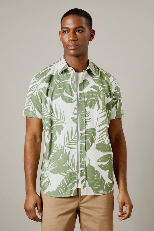 Bold leaf print design for a distinctive summer look
        Short sleeve construction with classic collar for casual comfort
        Button-through front with chest pocket detail
        Crafted from 100% cotton for breathable all-day wear
        Regular fit silhouette that suits most body types
    
    This Burton leaf print shirt brings a touch of tropical flair to your casual wardrobe without compromising on comfort. Perfect for warm-weather socialising, it pairs brilliantly with chino shorts and white trainers as shown for daytime pub garden gatherings. The versatile design works equally well with neutral trousers for evening drinks or family barbecues. The breathable cotton fabric ensures you'll stay comfortable throughout the day, whilst the classic cut maintains a smart-casual balance that Burton is known for. Layer under a lightweight bomber jacket when the temperature drops, or wear open over a plain white t-shirt for a relaxed weekend look. Machine washable at 30 degrees, this shirt combines practicality with effortless style for the modern British man who values both tradition and contemporary design.